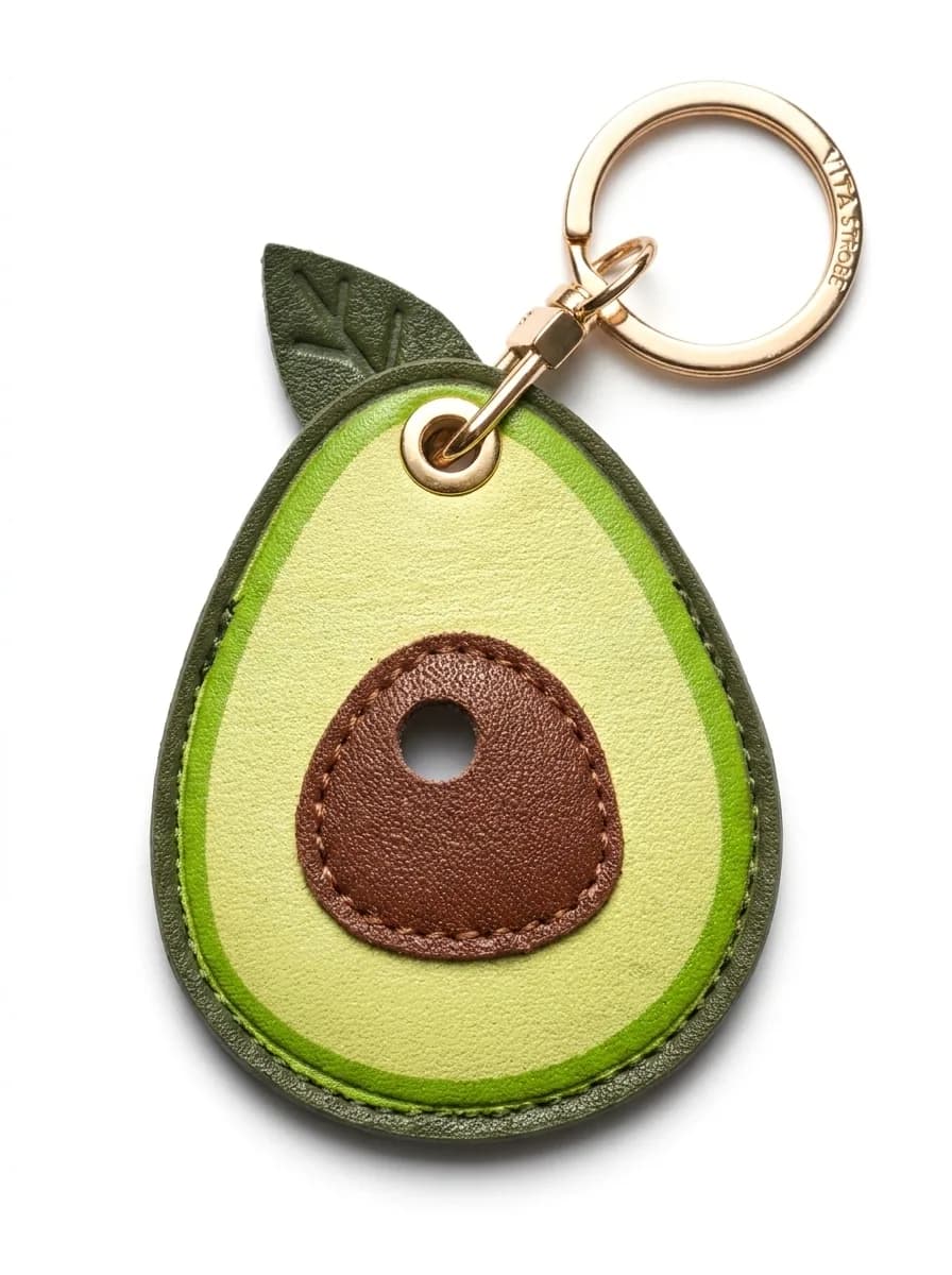 Avocado leather keyring on a white background