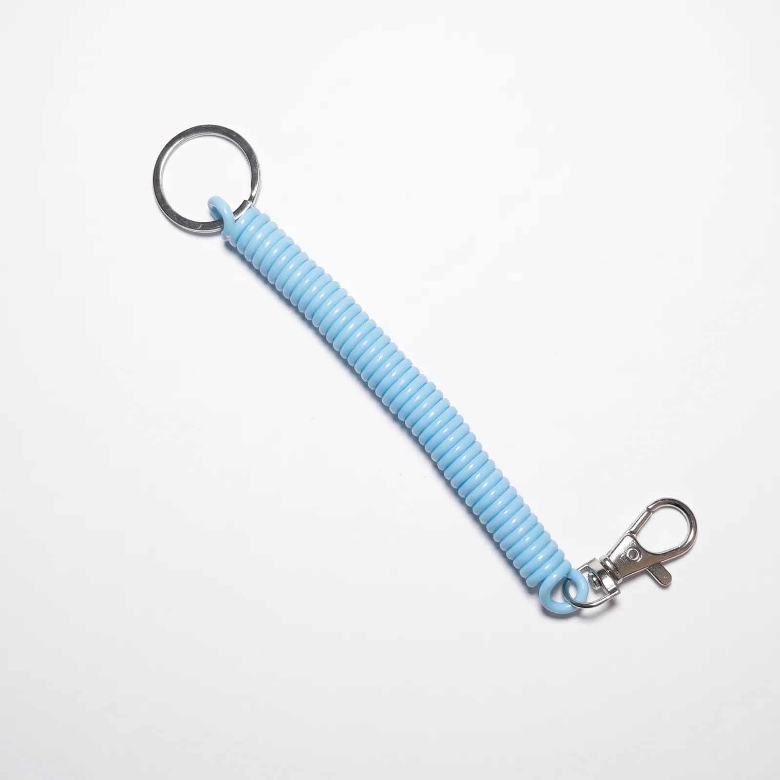 Sky blue coil keychain on a white background