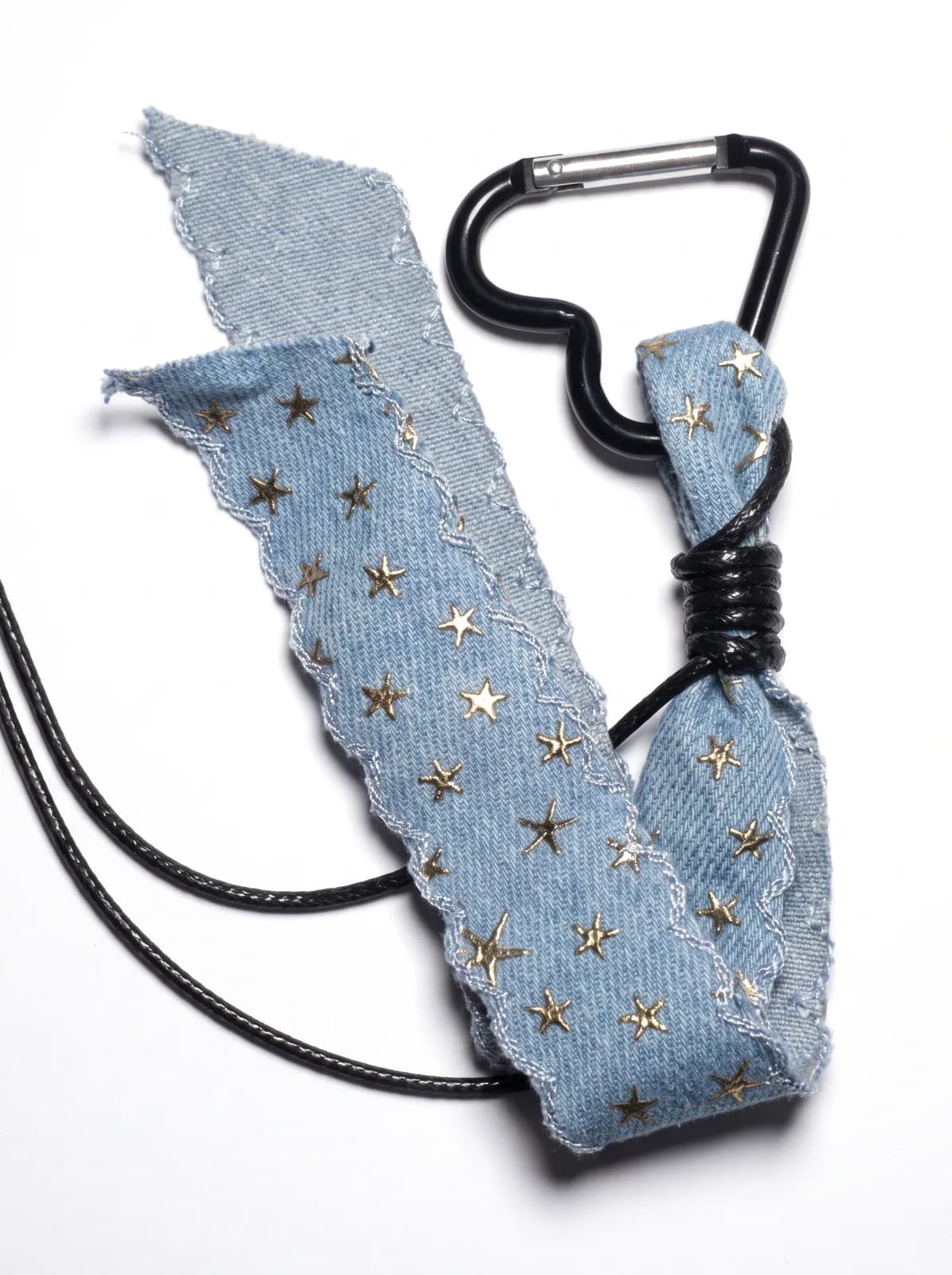 Denim star bow charm on a white background