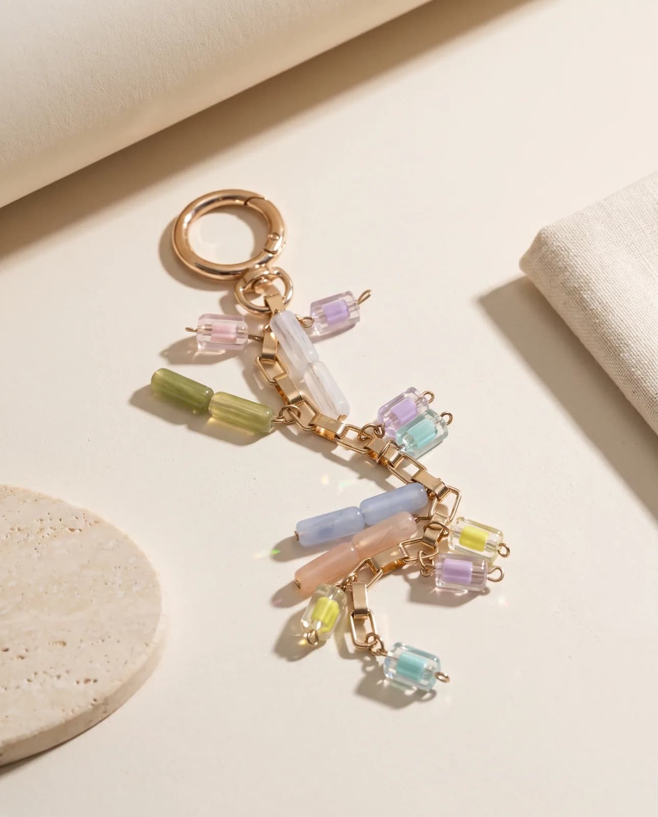Pastel glass chain charm on cream plaster