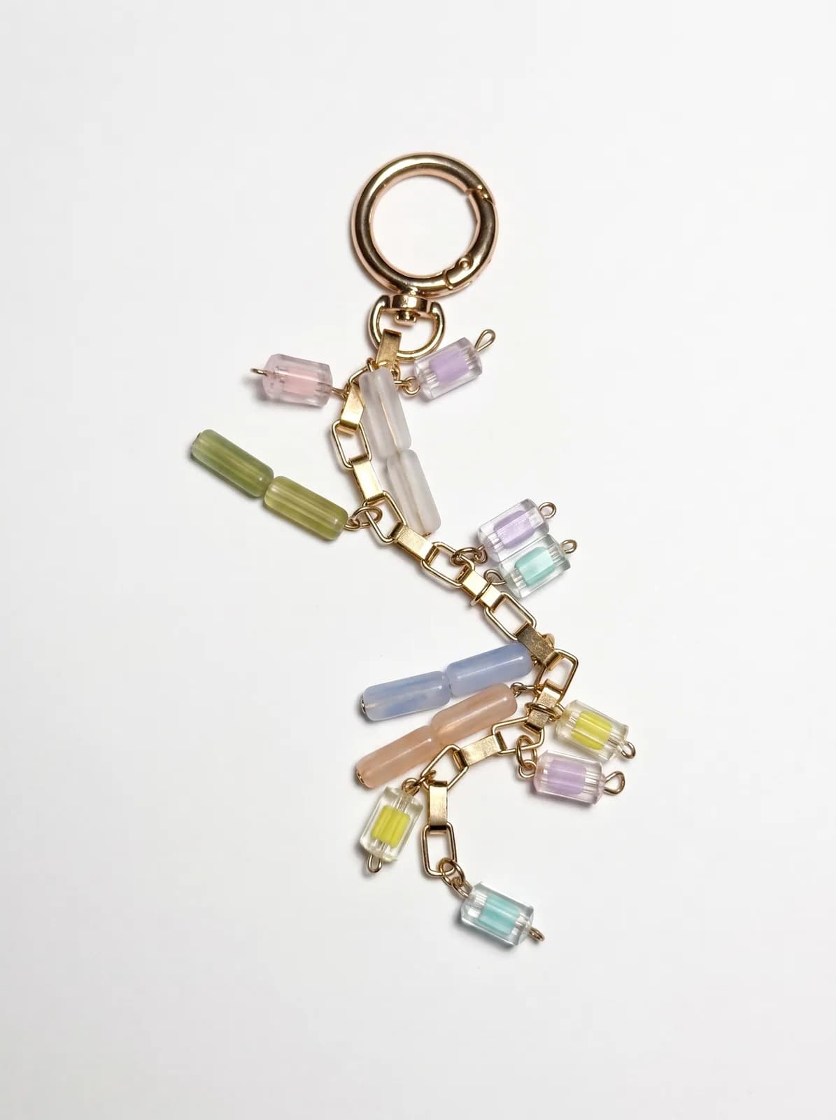 Pastel glass chain charm on a white background