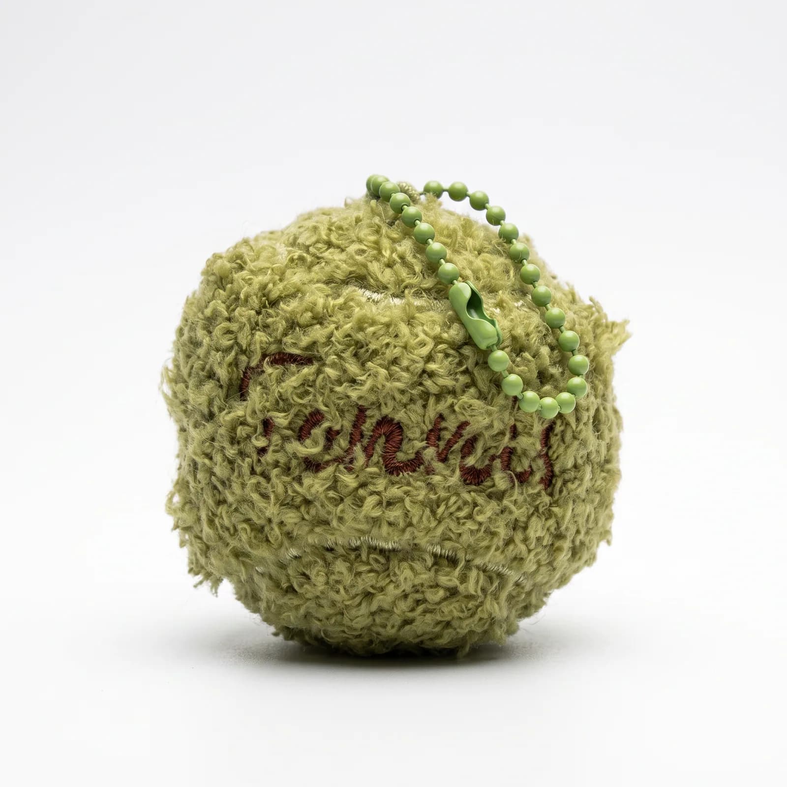Olive bouclé ball charm on a white background