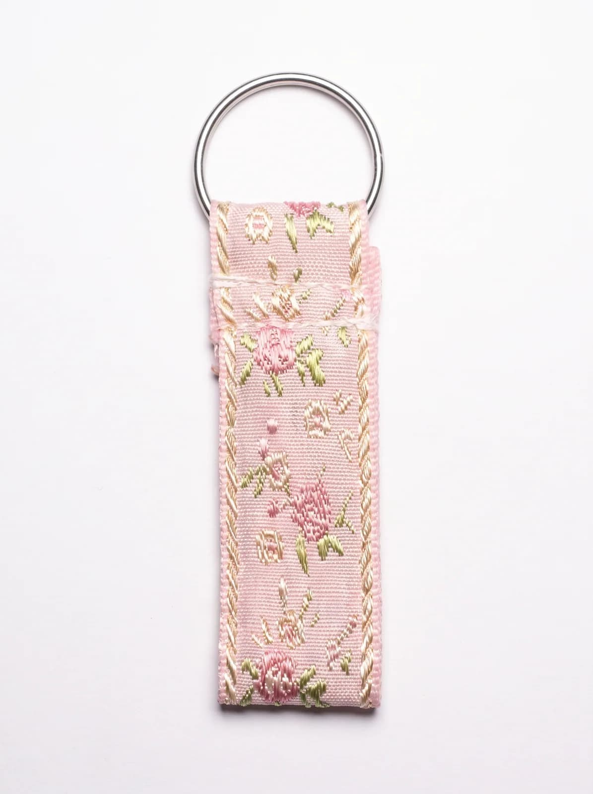 Rose brocade key fob on a white background
