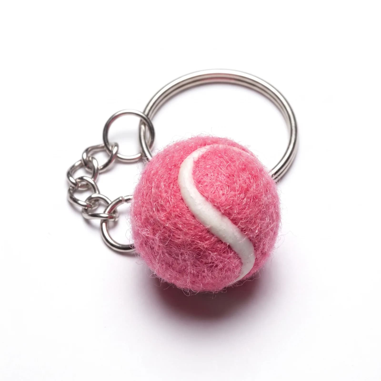 Pink tennis ball keyring on a white background