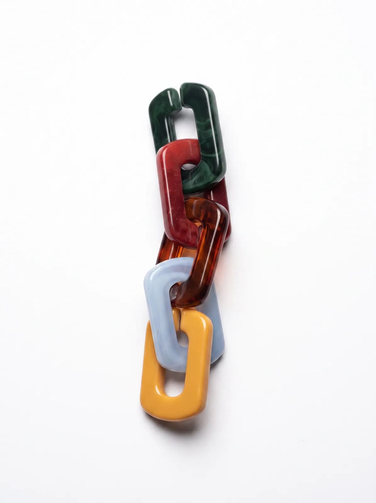 Resin chain charm on a white background