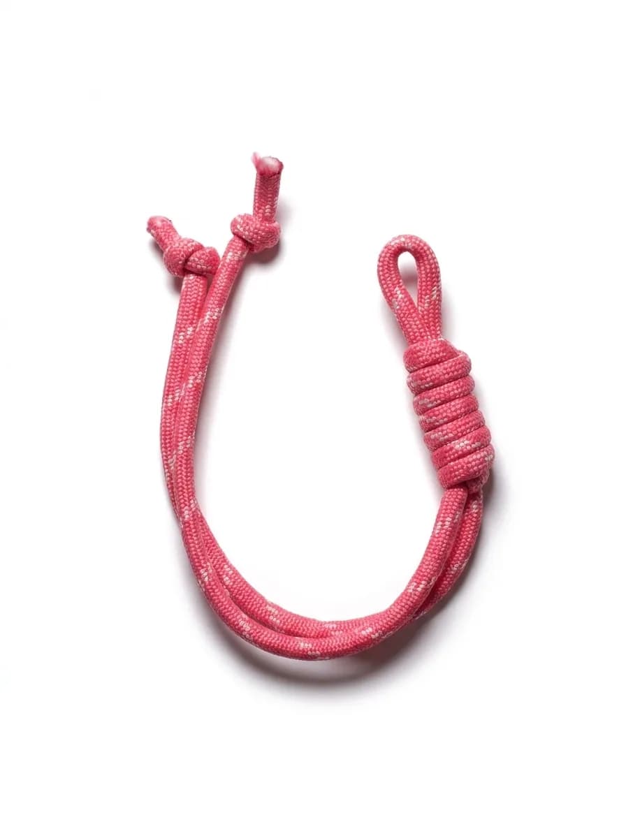 Raspberry paracord bracelet on a white background